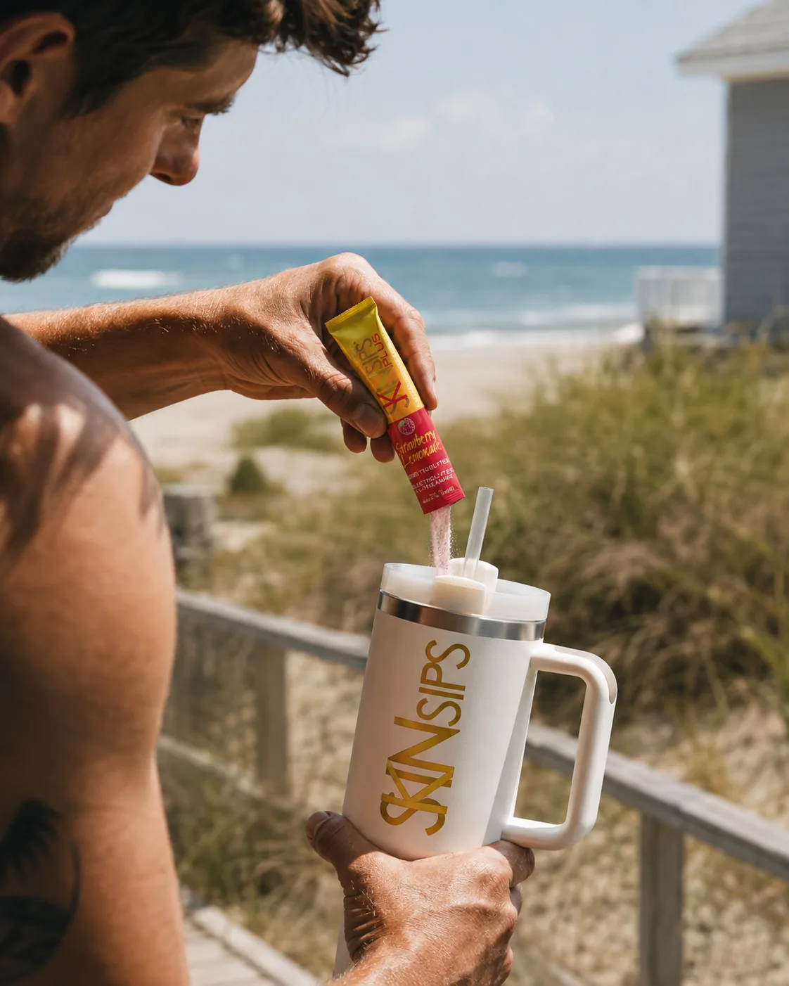 Person pouring SkinSips powder into a tumbler on a sunny beach walkway. — electrolytes and l-theanine for recovery